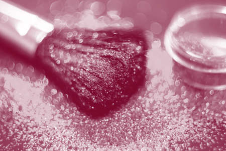texture of gold glitter on the makeup brush and design. We have a black background. Selective Focus - Pictureの写真素材