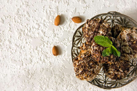 Useful homemade almond cake with coconut chips on a light background, copy space - Imageの写真素材