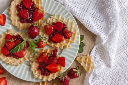 Viennese waffles with strawberries on a gray background. food photography - Image. Flat gasket. Flatleyの写真素材