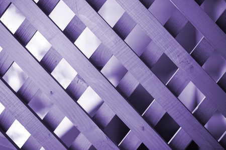 texture of a decorative lattice made of wood, surface and pattern of wood, wooden slats.Very Peri - color 2022の写真素材