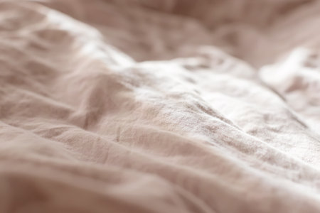 view of the morning crumpled bed in the hotel room. in the morning light. Cozy morning atmosphere. unmade bedding for sleeping. Shallow depth of field. selective focus. color 2022の写真素材