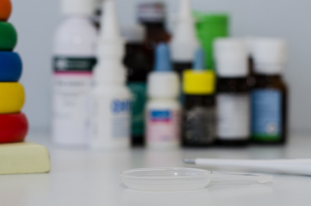 medicine bottles for children and a thermometerの写真素材