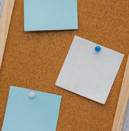 cork board reminder with stickers and push pinsの写真素材