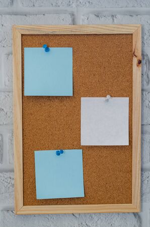 cork board reminder with stickers and push pinsの写真素材