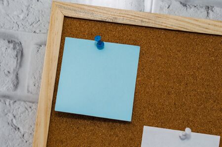 cork board reminder with stickers and push pinsの写真素材