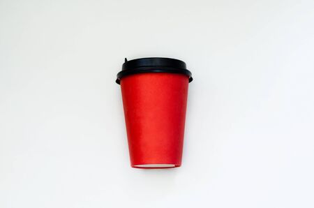 disposable paper red cup on a white backgroundの写真素材