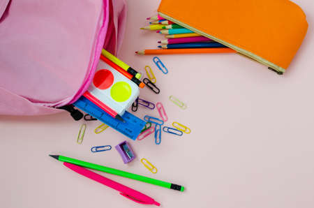 back to school, pink satchel with colored school suppliesの写真素材