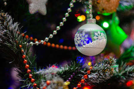 christmas tree close-up with christmas decorations, background with shallow depth of fieldの写真素材