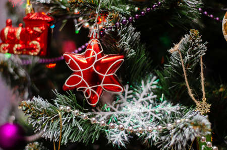 christmas tree close-up with christmas decorations, background with shallow depth of fieldの写真素材