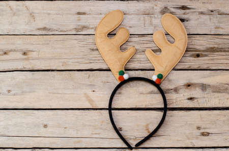 deer antlers headband on wooden backgroundの写真素材