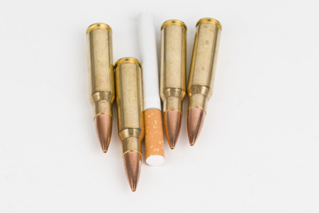 Cigarette and bullets の写真素材
