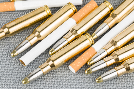 Cigarette with bulletsの写真素材