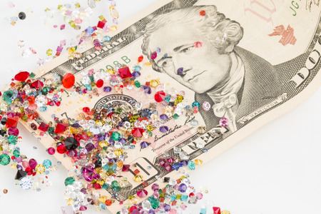Collection of many different natural gemstones and banknotes  の写真素材