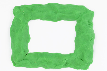 Children bright plasticine  frame on gray background - Stock Image macro の写真素材