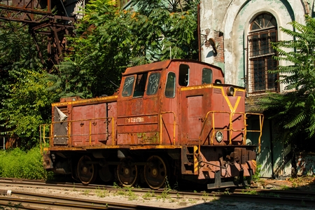 Rostov - on - Don, Russia - August 09, 2015: Old rusty Russian train in the territory of thrown factory, established near Green Island in Rostov - on - Don.のeditorial素材
