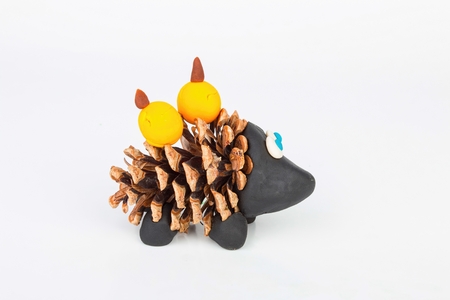 Hedgehog from pine cone and plasticine. Stock image macro.の写真素材