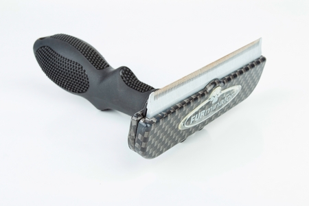 Rostov - on - Don, Russia - December 1, 2015: Furminator groomer for remove fur moult in cats and dogs.のeditorial素材