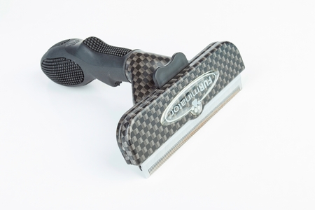 Rostov - on - Don, Russia - December 1, 2015: Furminator groomer for remove fur moult in cats and dogs.のeditorial素材