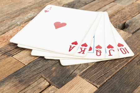 Poker cards, Royal flash on wooden background. Macro shot.の写真素材