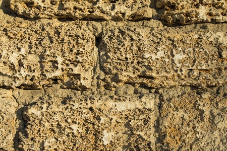 Old brick wall with cracks and scratches. Macro shot.