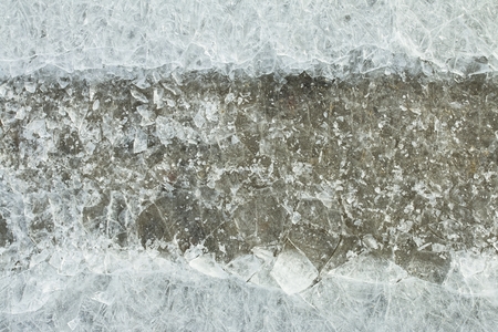 Traces of car on ice. Texture of ice surface. Macro shot.の写真素材