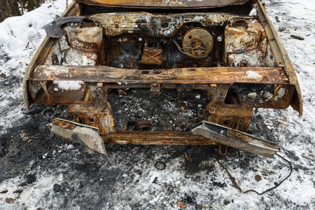 Burned car after a fire happened in winter park. Stock image.の写真素材