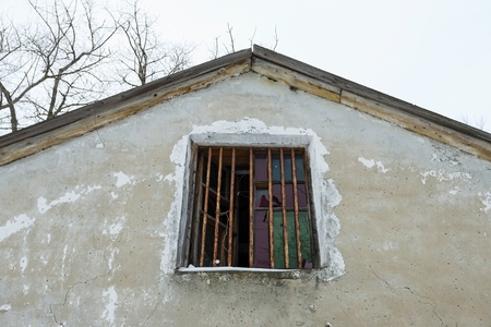 Old broken window on ruin house. Stock image.の写真素材