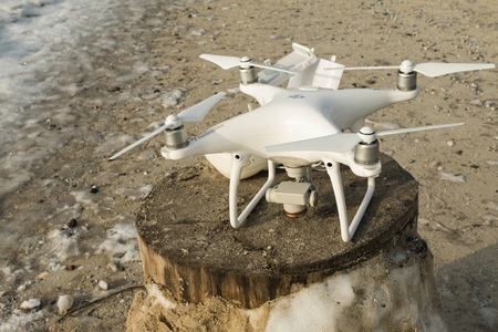 Rostov - on - Don, Russia - January 04, 2017: Flying drone quadcopter Dji Phantom 4 with high...