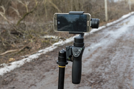 Rostov - on - Don, Russia - January 07, 2017: DJI Osmo mobile gimball device and Samsung Galaxy S6 phone.のeditorial素材