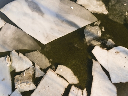 Ice floating on river in spring time. Winter landscape with melting of ice floe. Aerial view.の写真素材