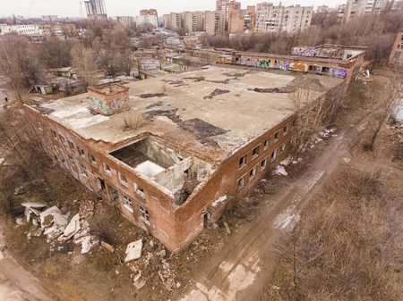 Abandoned industrial building in winter time. Aerial view.の写真素材