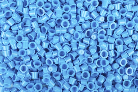 Blue caps for tattoo ink. Macro shot.
