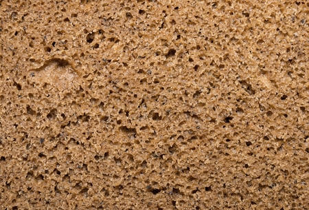 Brown bread, background texture. Macro shot.
