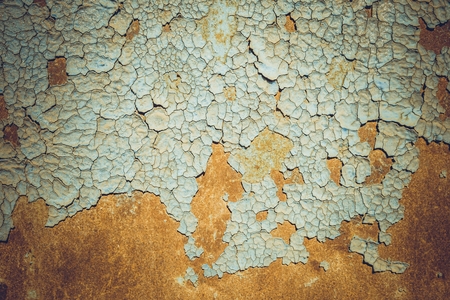 Abstract corroded colorful rusty metal background. Blue paint flaking and cracking texture on rusty...
