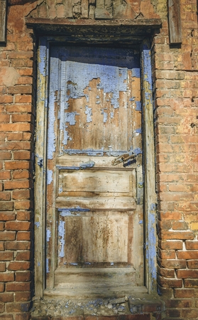 Old abandoned door, detail of a door of a house in ruins. Stock image.の写真素材