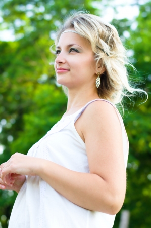 summer portrait of a young woman outdoorsの写真素材