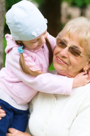 Portrait Of Grandmother With Granddaughter Relaxing Togetherの写真素材
