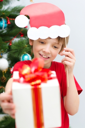 happy boy with Christmas presentの写真素材