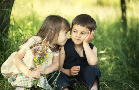 Adorable happy kids couple outdoorsの写真素材