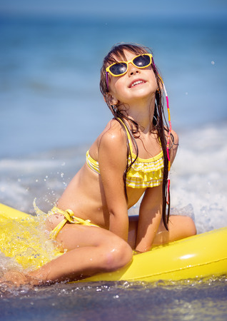 Cute little girl swimming and having funの写真素材