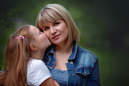 Closeup portrait. Mother with daughterの写真素材