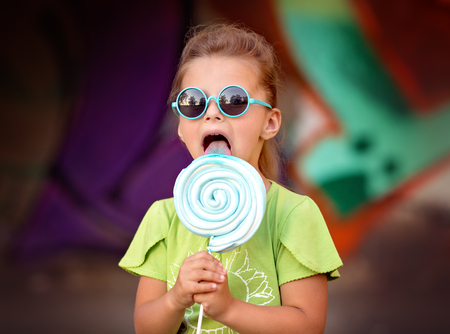 Cute little girl with lollipopの写真素材
