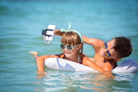 Cute children taking selfieの写真素材