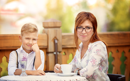 Mother with son having breakfast togetherの写真素材
