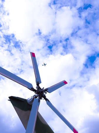 Helicopter propeller and plane in the blue skyの写真素材