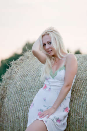 young beautiful woman on the summer field