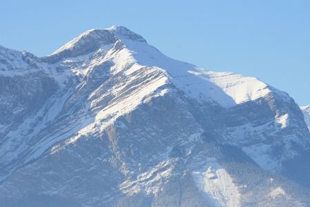 pure rock covered by snow, canada