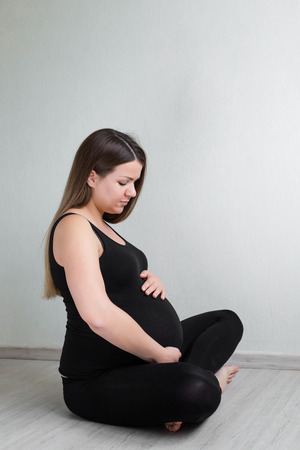 Pjrtrait of the pregnant woman awaiting babyの写真素材