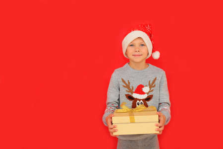 The child experiences the emotions of receiving a Christmas presentの写真素材