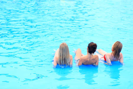 Young girls on the background of water in the poolの写真素材